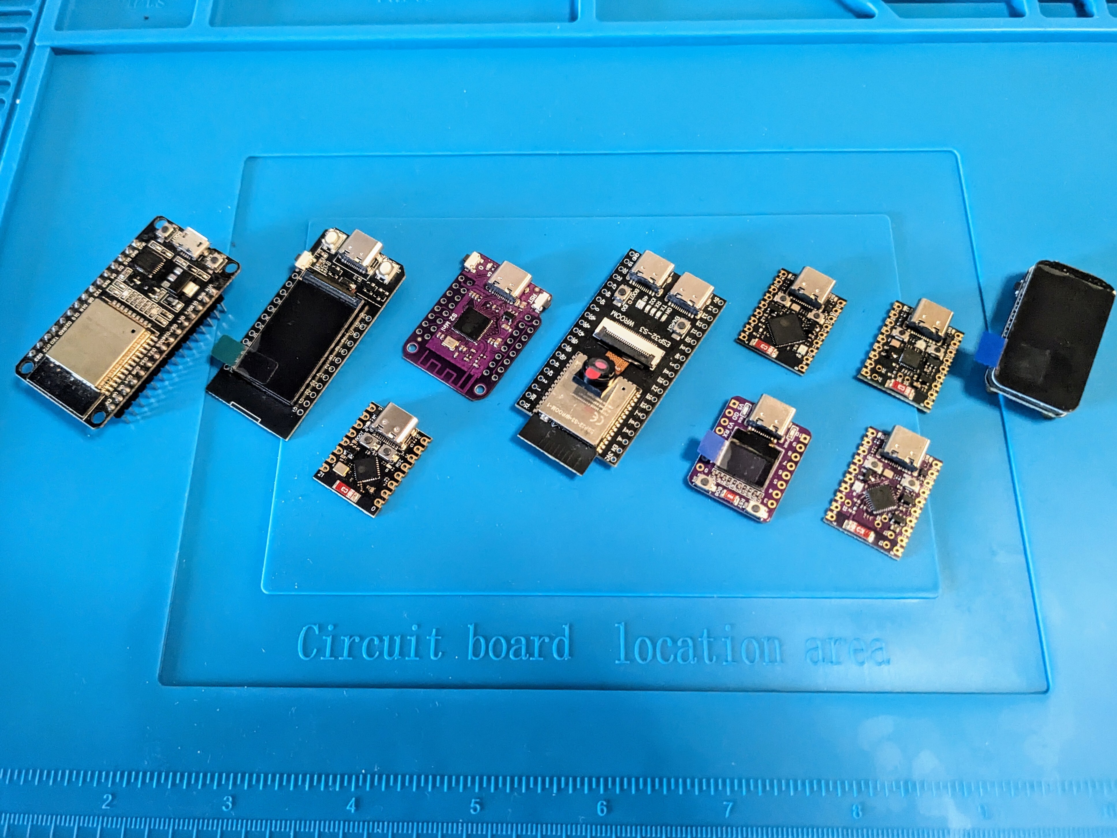 assortment of various ESP32 development boards