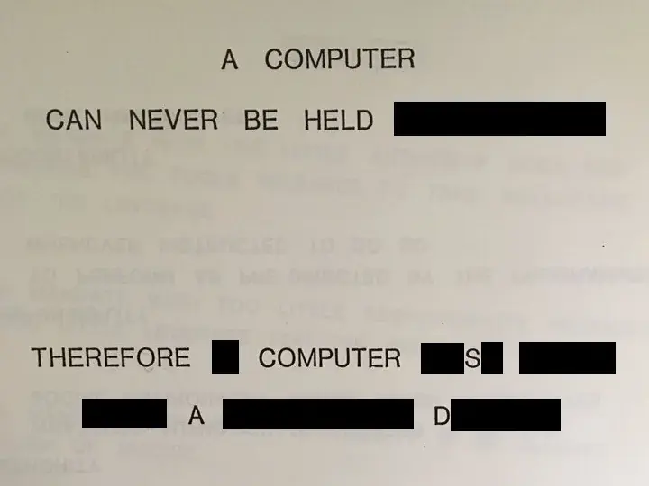 Text on a page selectively blacked out to read: "A COMPUTER CAN NEVER BE HELD THEREFORE COMPUTER SAD".