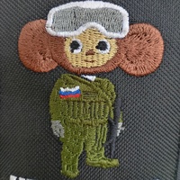 Cheburashka in camouflage and with what looks like skiing glasses