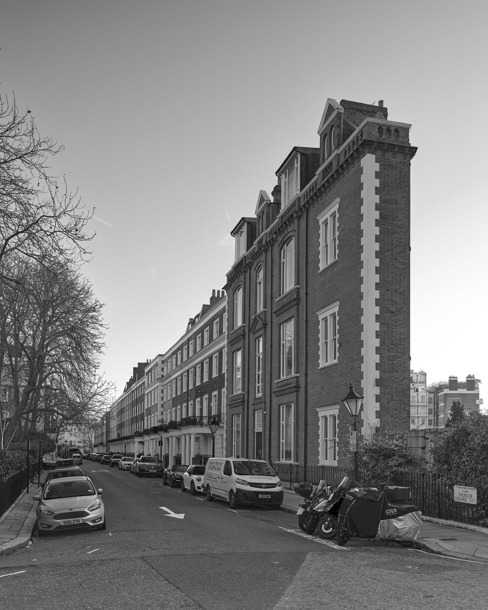 An improbably shallow row house at the end of a residential street.